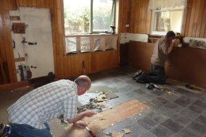 Tom and Paul working in the gutted kitchen.