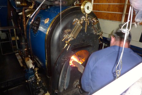 The engineer stocking the fire.