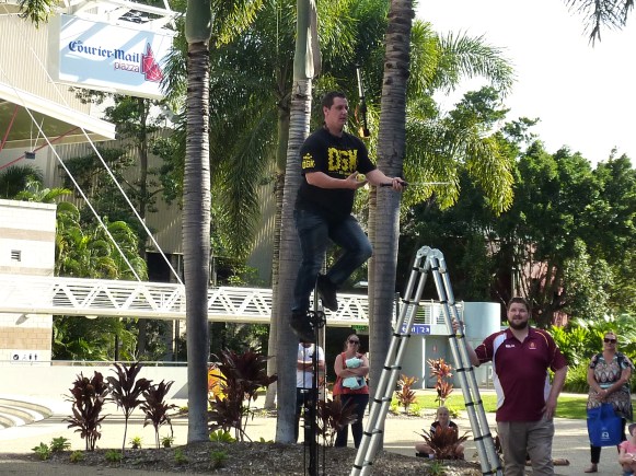 Busker riding 9ft unicycle. He also juggled 5 flaming torches.