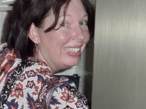 Alice slaving over a hot stove.